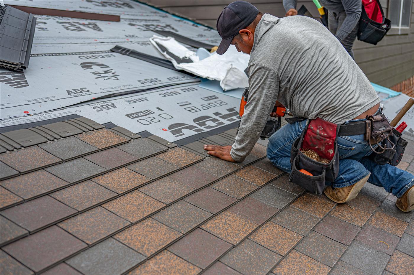 Roofer carefully matching tile on a historic St Augustine home