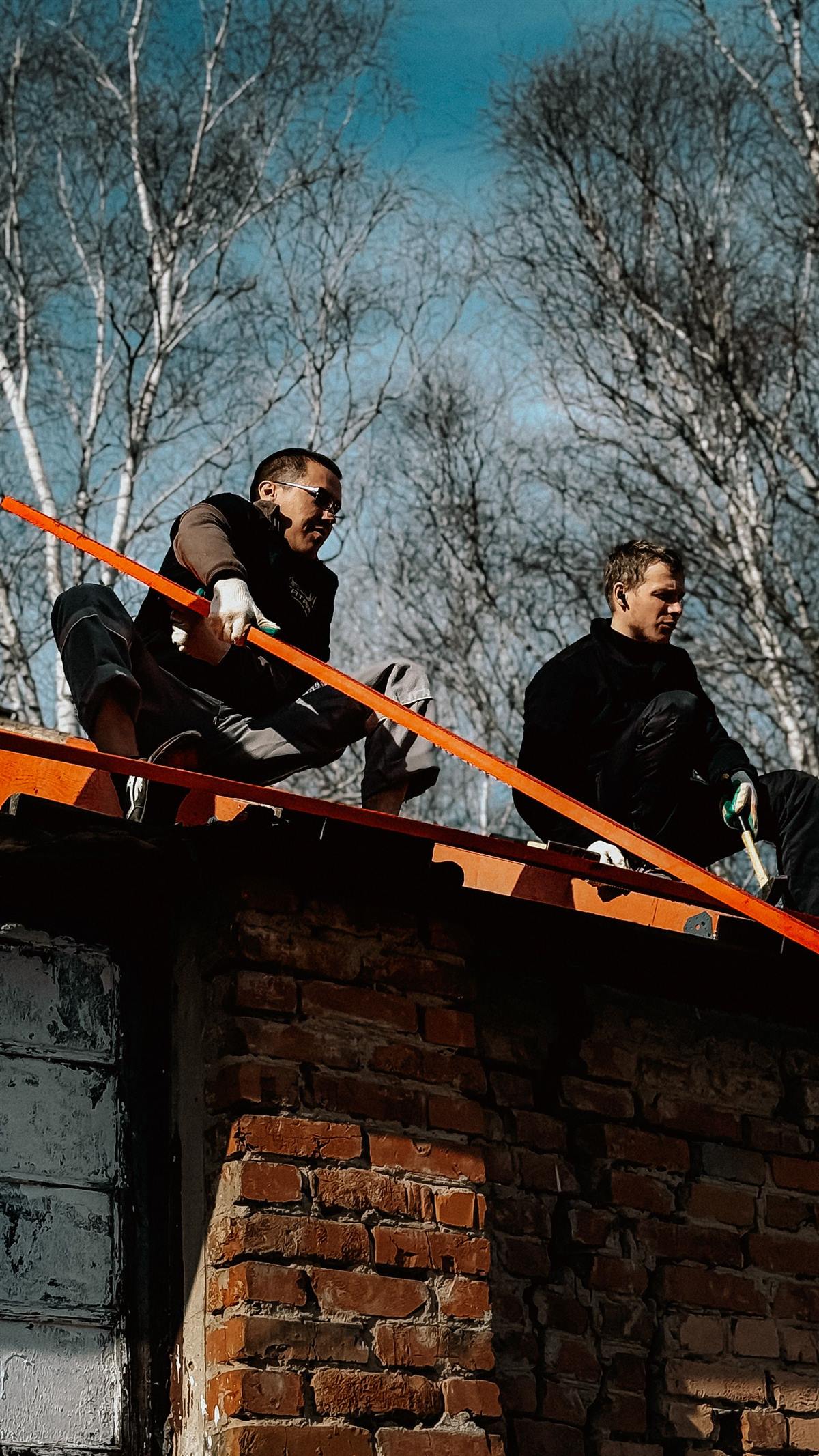 Licensed roofing crew working together on an Orange Park roof