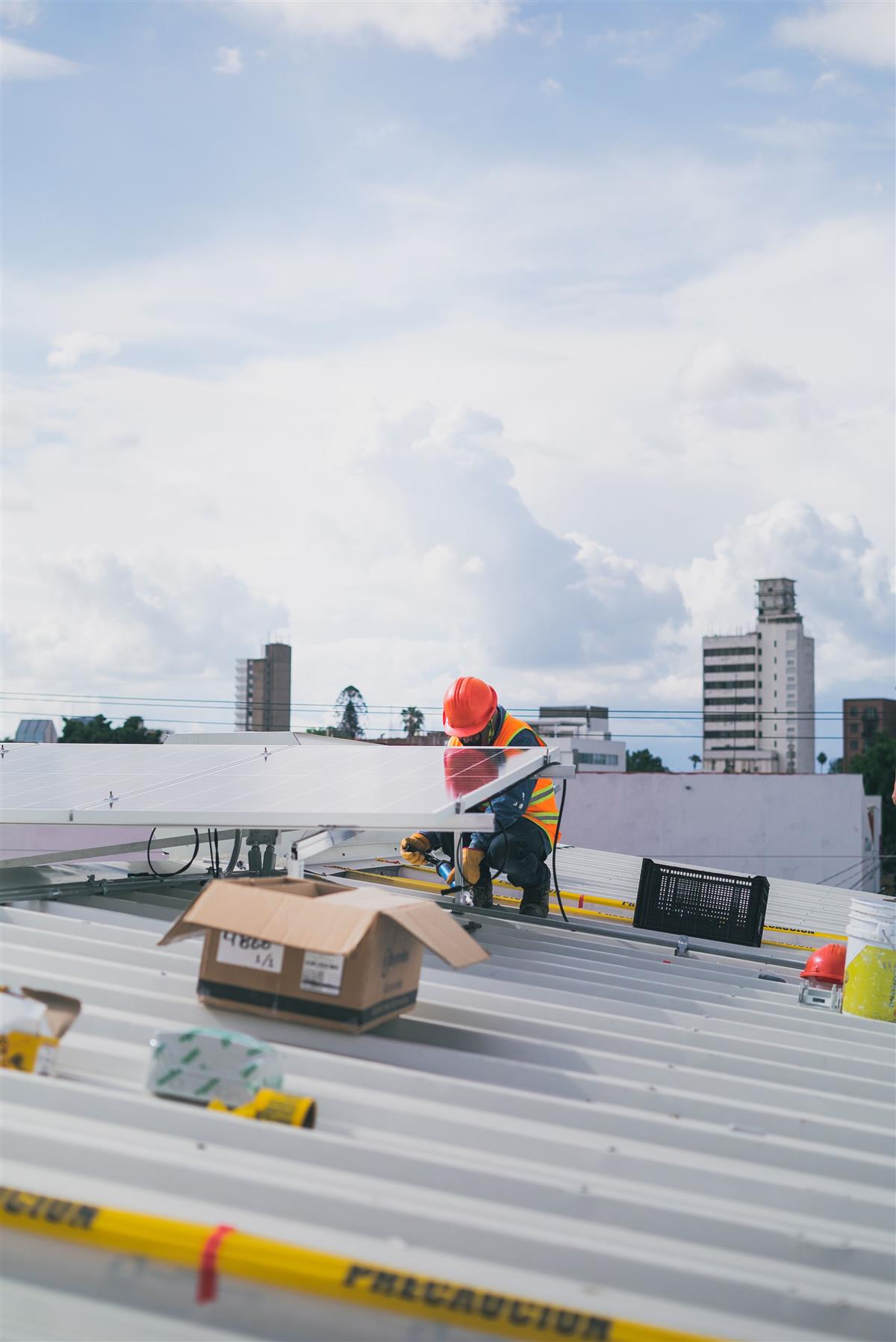 Roofer working on a commercial metal roof in the Yulee area