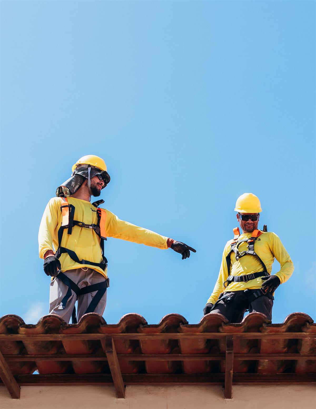 Roof Repair Jacksonville FL crew applying a protective roof coating