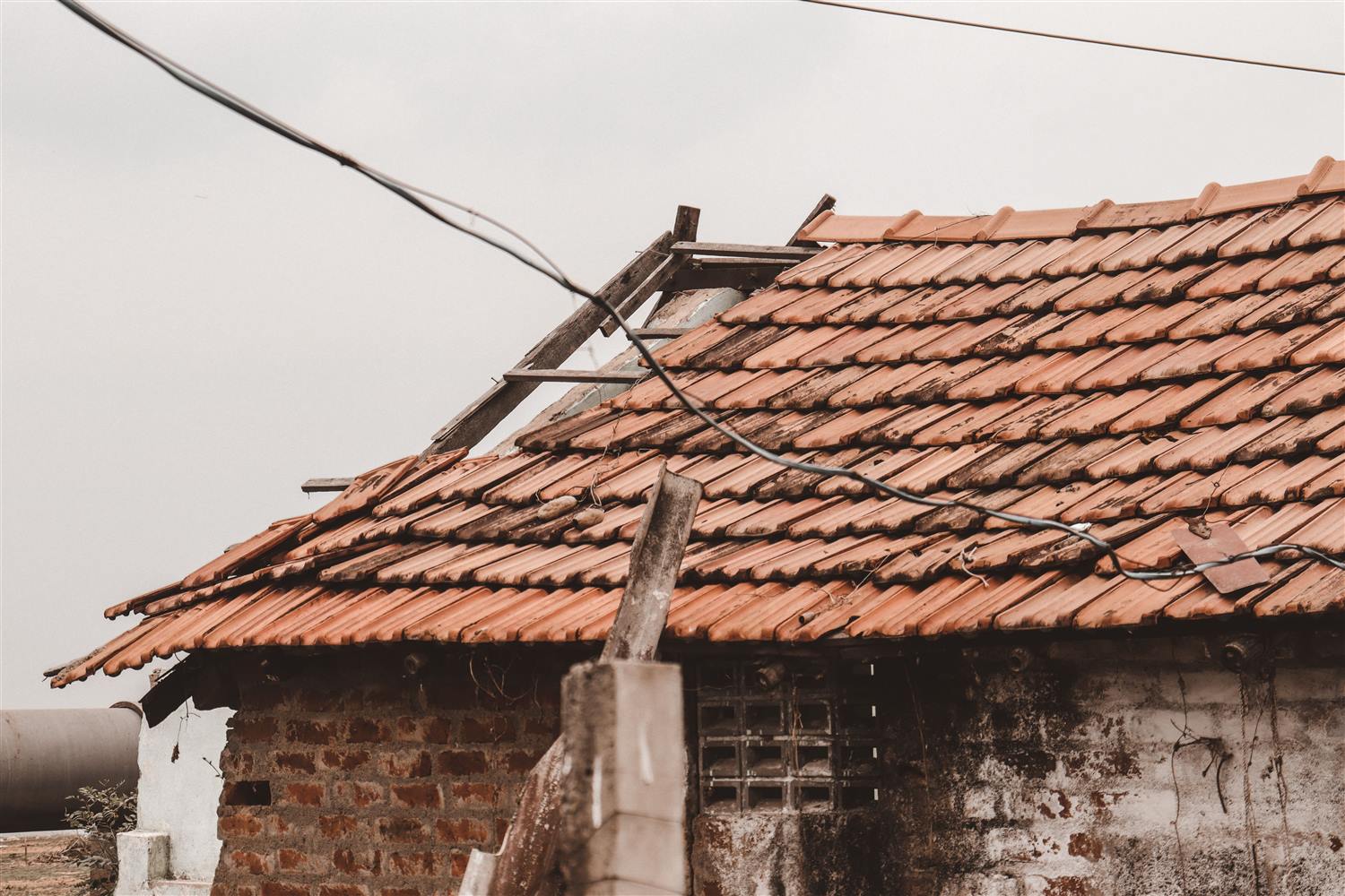 Experienced crew repairing an aged tile roof in an established Jacksonville neighborhood