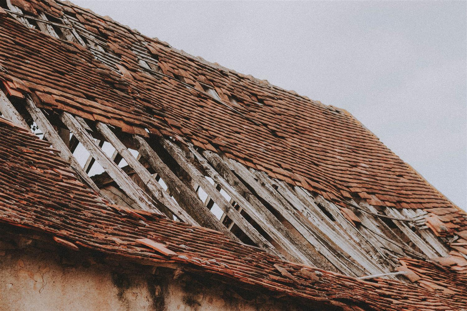 Damaged and slipped tiles on a Jacksonville tile roof needing repair