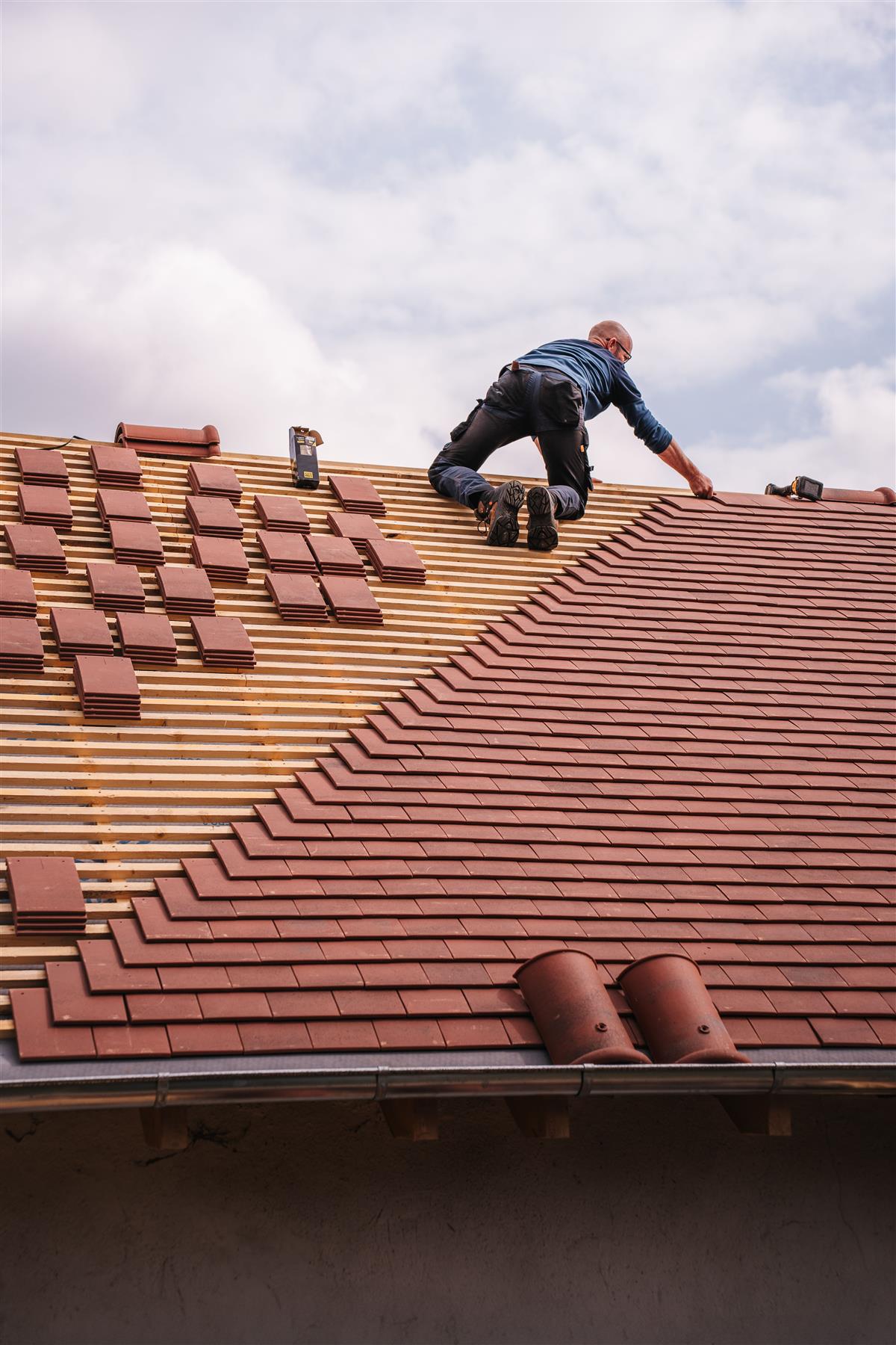 Licensed crew installing a new roof to manufacturer specification in Jacksonville